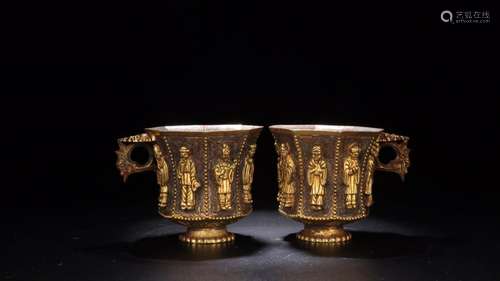 : a cup of a pair of gold charactersSize: 8.4 cm wide and 6....