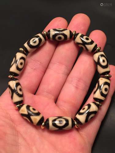 Canine teeth third day bead braceletWealth of bead is the go...