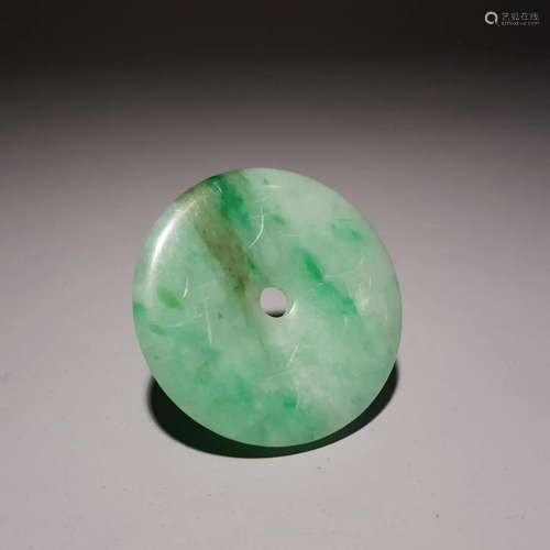 A Fine Carved Jadeite Pendant