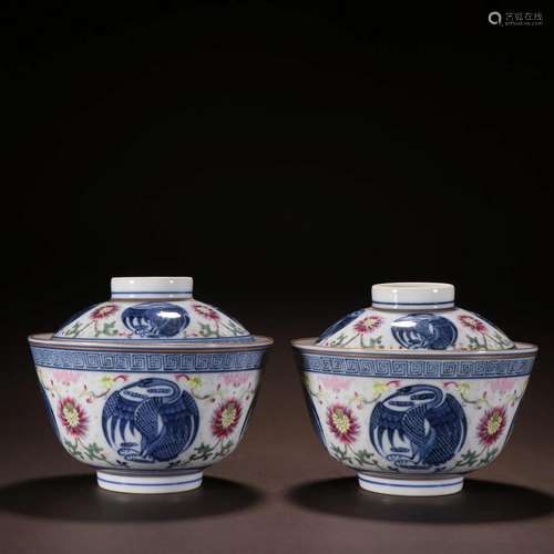 A Pair of Blue and White Cups With Covers