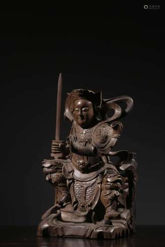 Longan wood xuan day god's statueSize: 28.3 cm high, 15....