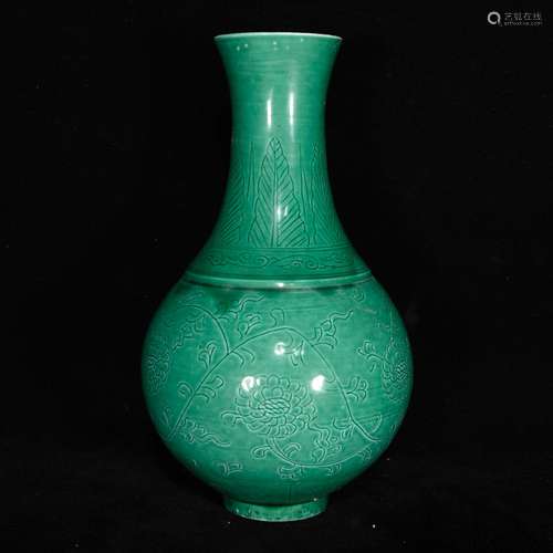 Dark green glaze carved flowers around branches grain bottle...