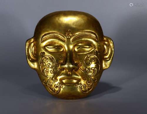 Liao: copper and gold mask22 cm long and 21.7 cm wide weighs...