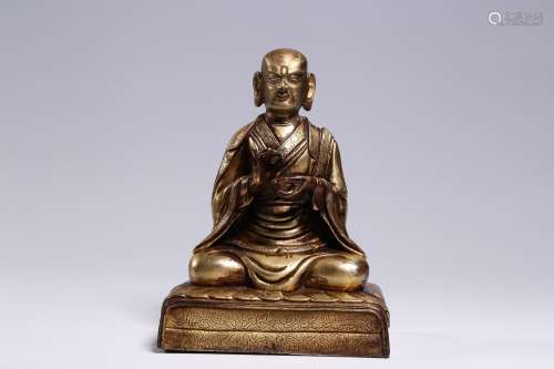 T's statue,copper and gold15 cm tall.11 cm long.7.5 cm w...