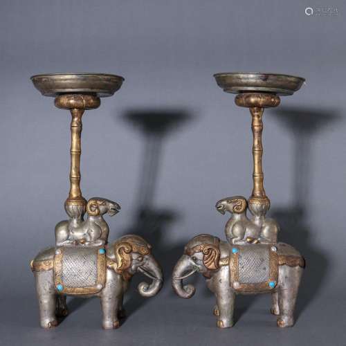 Silver and gold pictographic candlestick a pairSpecification...