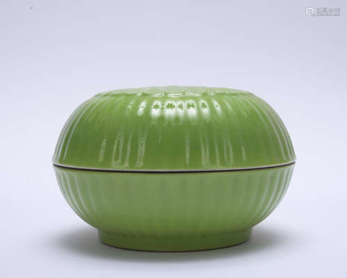 A green glazed jar and cover