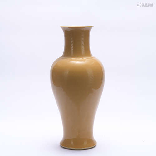 A yellow glazed vase