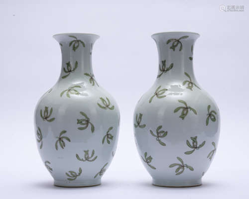 A pair of white glazed 'green leaves' bottle