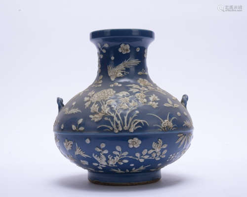 A blue glazed 'floral and birds' vase