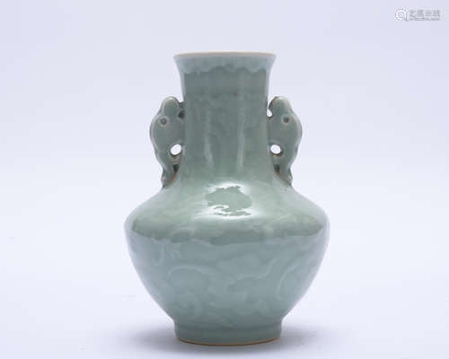 A celadon-glazed vase