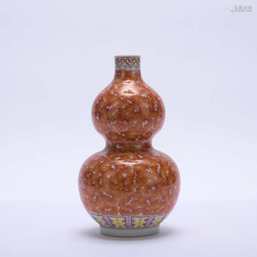 An allite red glazed gourd-shaped vase