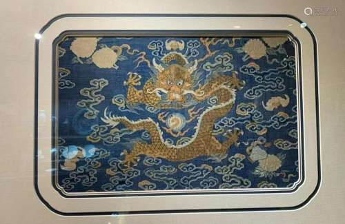 In the Qing Dynasty, blue tapestry with five-claw gold drago...