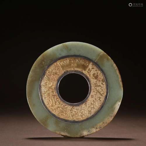 In the Qing Dynasty, Hotan jade was inlaid with silver gilde...