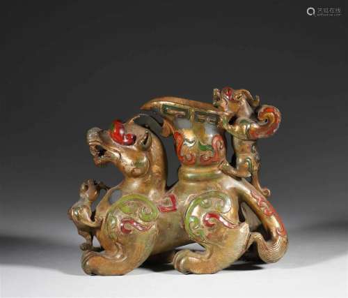 In ancient China, Hotan jade painted with gold beast-horn cu...