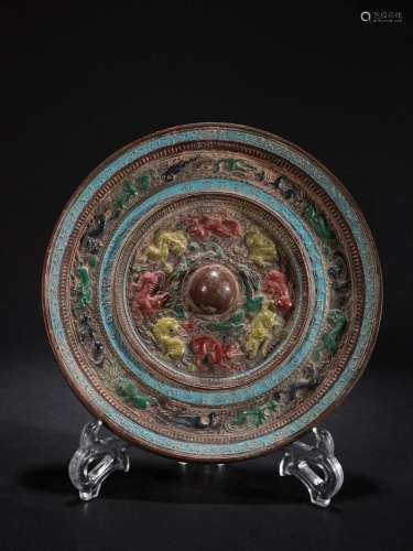 In the Ming Dynasty, bronze mirrors with colored animals wer...
