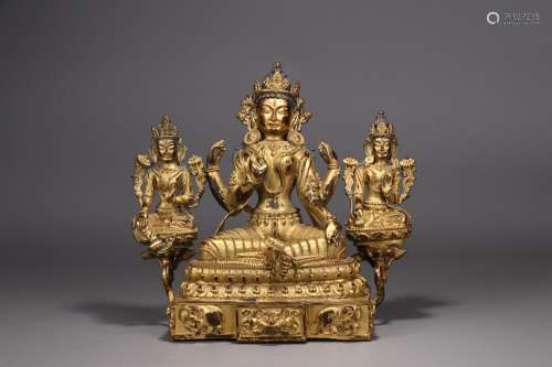 A third straight: copper and gold four arm guanyin cave25 cm...