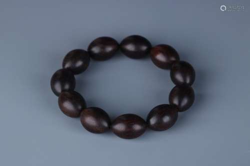 String, lobular rosewood olive beads handSize: bead diameter...