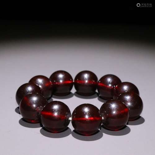 Blood amber round pearl hand string.Specification: bead diam...