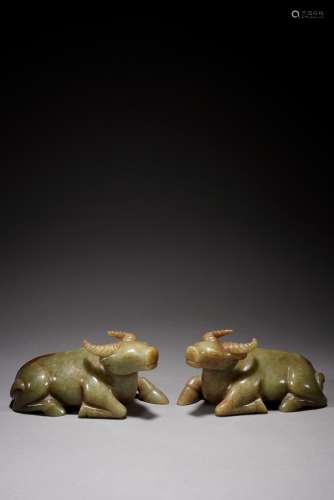 A PAIR OF ANCIENT JADE LYING COWS