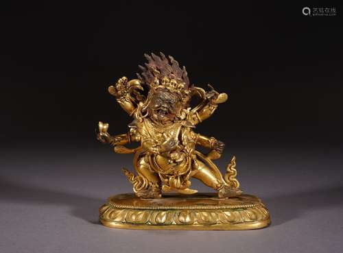 A GILT BRONZE FIGURE OF STANDING MAHAKALA