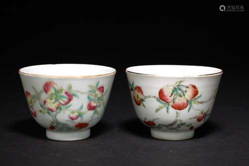 A PAIR OF FAMILLE ROSE 'NINE PEACHES' CUPS