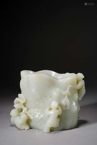 A CHINESE WHITE JADE 'BOYS' BRUSHPOT