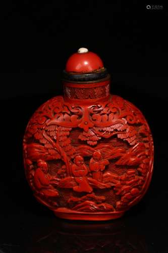A CARVED CINNABAR LACQUER SNUFF BOTTLE