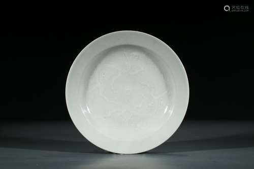 A WHITE GLAZE MOULDED 'DRAGON' DISH