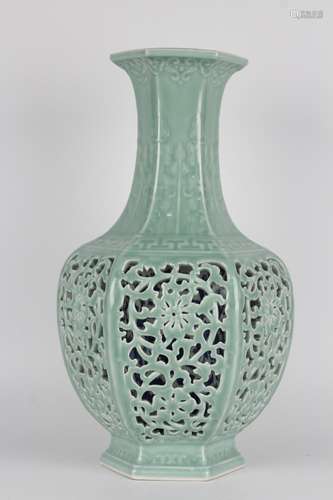 - pea green glaze relief hollow branch ofblue and white vase...