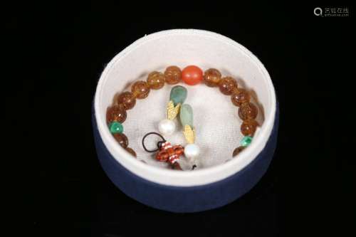 Old, amber 18 child holding a good old amber, pearl carved g...