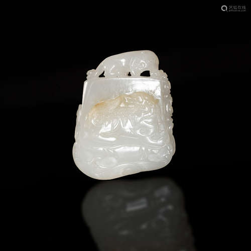 十八世紀   白玉雕瑞獸佩A Chinese carved white jade beast pla...