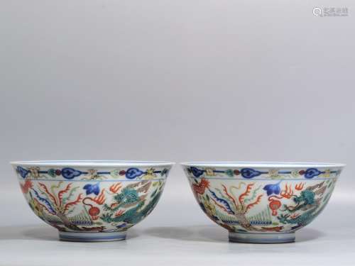 A pair of blue and white color bucket longfeng bowl high cal...