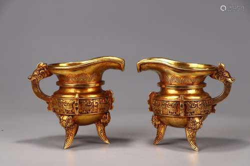 : copper and gold goblet of a couple14 cm long and 10 cm wid...