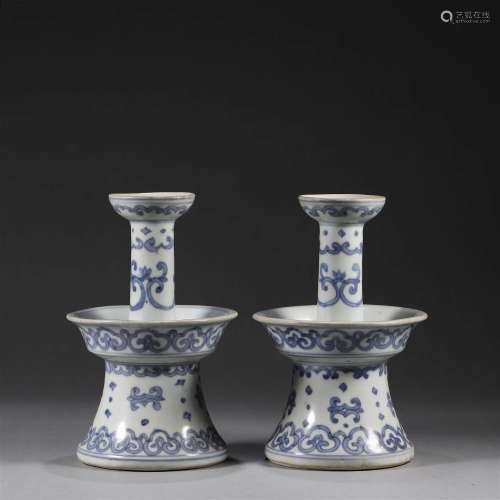 A pair of blue and white ruyi porcelain candlesticks