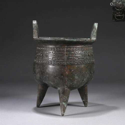 A taotie patterned double-eared bronze pot