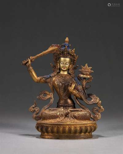 A gilding copper Manjusri statue