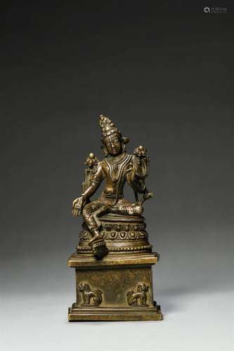 A silver-inlaid copper green tara statue