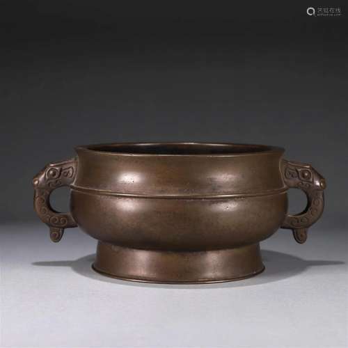 A copper censer with dragon shaped ears