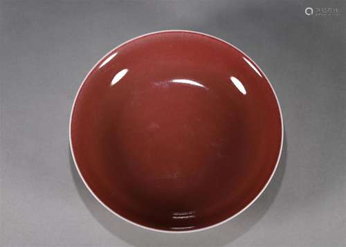 A red glaze porcelain plate