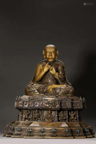 A gilt silver-inlaid copper buddha statue