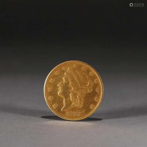 A figure patterned gold coin