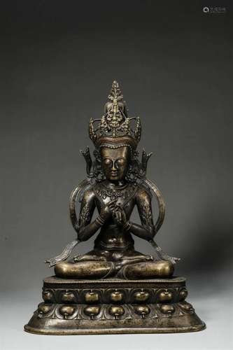 A silver-inlaid copper buddha statue