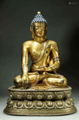 A silver Sakyamuni buddha statue