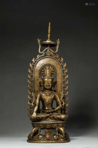 A silver-inlaid copper buddha statue