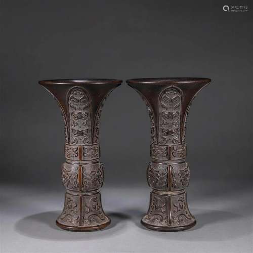 A pair of beast face patterned copper beaker vases