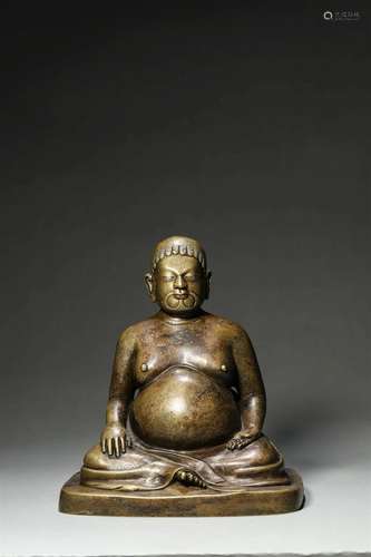 A silver-inlaid copper buddha statue