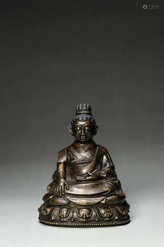 A copper buddha statue