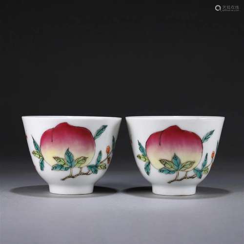 A pair of famille rose peach porcelain cups