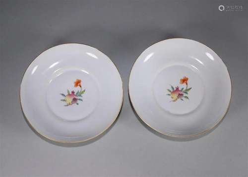 A pair of famille rose pomegranate porcelain plates