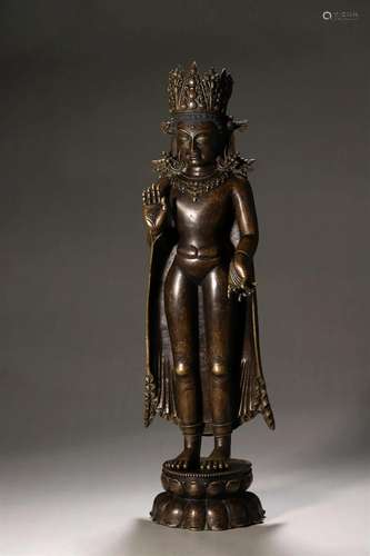 A silver-inlaid copper Sakyamuni buddha statue with gold cro...